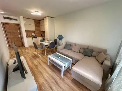 a living room with a couch and a table at 5 min from the Airport in Sofia