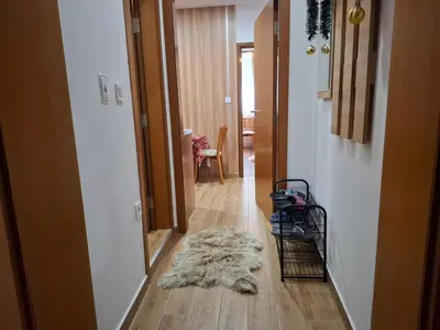 a furry rug on the floor of a hallway at Двуспален апартамент Милена в хотел Росица,Пампорово in Pamporovo