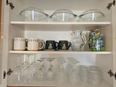 a shelf filled with glass vases and mason jars at Viva 4-A-23 Apartment ski to the door complex Grand Monastery Pamporovo in Pamporovo