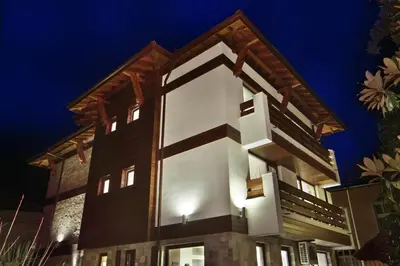 aominium building with a lit up facade at night at Anita Guest House & Relax in Perushtitsa
