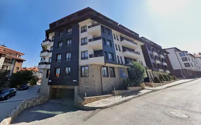 a large building on the side of a street at Aspen Apartment A409 3OOm from Gondola in Bansko