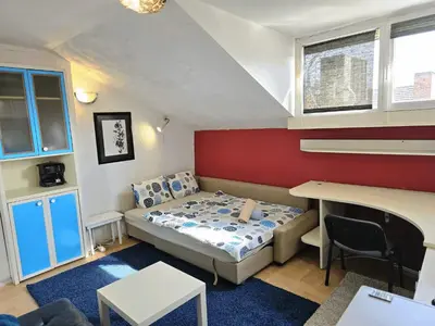 a small room with a bed and a desk at The Little Pearl of Sofia in Sofia