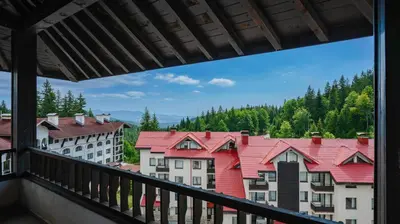 a view from a balcony of buildings and trees at Penthouse Astralis - Pamporovo in Pamporovo