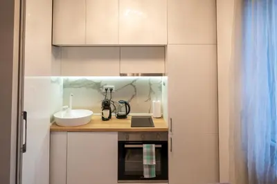 a small kitchen with a sink and a counter at Luxury Studios in Top Center in Sofia
