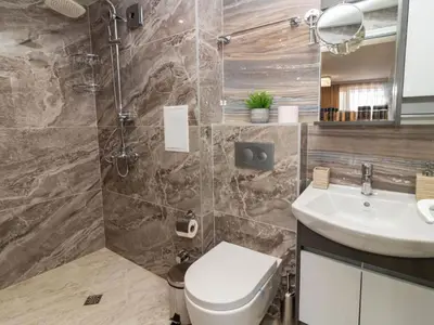 a bathroom with a toilet and a sink at MezonetCentre in Sofia