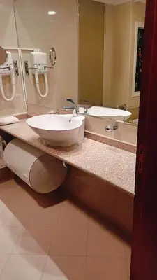 a bathroom with a sink and a mirror at Downtown Resort Bansko- Eliko Suite in Bansko