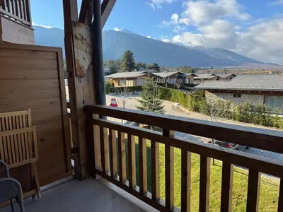 a balcony with a view of a mountain at Pirin Golf SP Apartments in Razlog