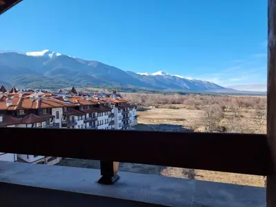 a view from the balcony of a building with mountains at Belvedere private apartment 1-bedroom with balcony in Bansko