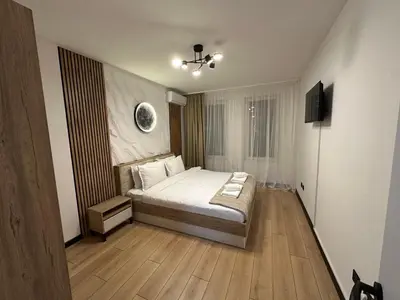 a bedroom with a bed and a television in it at MonarX Suites 1113 in Bansko
