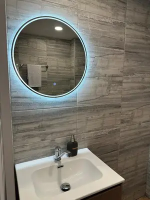 a bathroom with a sink and a mirror at MonarX Suites 1113 in Bansko