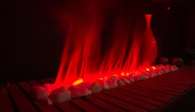 a hot dog grill with red flames and a vase at Семеен хотел БОНЖУР in Panagyurishte