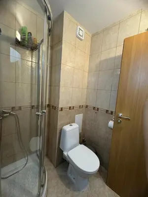 a bathroom with a toilet and a shower at Mountain view Lux Apartment in Bansko