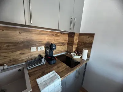 a kitchen with a wooden counter top in a room at Mountain view Lux Apartment in Bansko