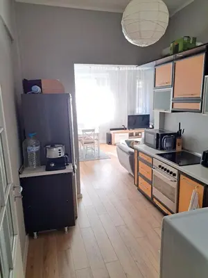 a kitchen with a refrigerator and a counter top at Apartment Sofia top center in Sofia
