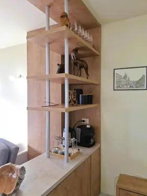 a kitchen with wooden shelves in a room at Woodsy views 1 bedroom apartment in Bansko