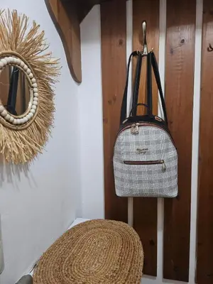 a bag hanging on a wall next to a basket at Gondola Peak Apartment in Bansko