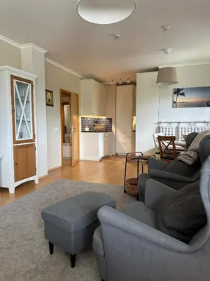 a living room with a couch and a table at Pravets Lake Home away from home in Pravets