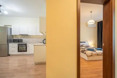 a kitchen and a bedroom with a bed at 2 bedroom Urban retreat in Sofia