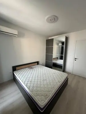 a white bedroom with a large bed in it at Lovely Stylish Brand New Flat in Sofia