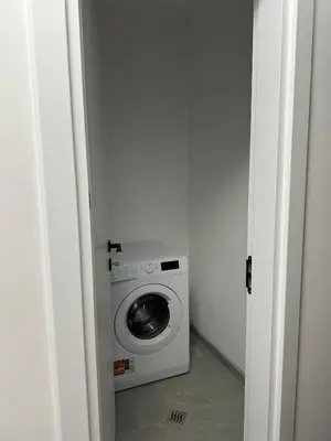a washer and dryer sitting in a room at Lovely Stylish Brand New Flat in Sofia