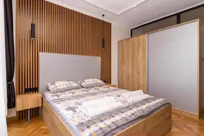 a bedroom with a large bed with pillows on it at Brand new Apartments in Sofia Center, Steps to Metro, NDK, Vitosha boulevard in Sofia