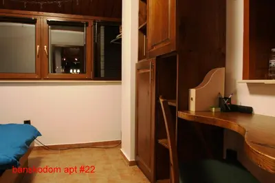 a room with a desk and a room with a window at Banskodom in Bansko