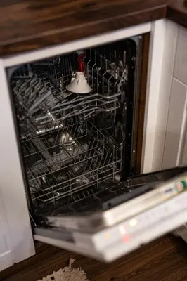 an oven with a rack of utensils in it at Host2U Authentic Bansko Apartment - Free Parking in Bansko