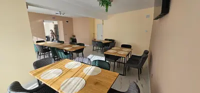 an overhead view of a restaurant with wooden tables and chairs at Къща за гости ЕСТЕТ ESTET Guest house in Oreshak