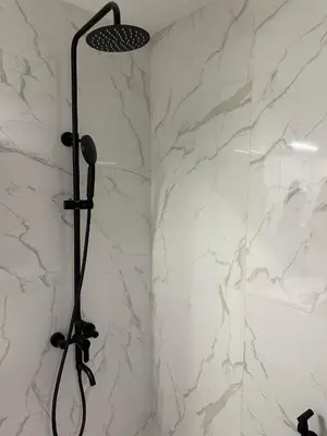 a shower stall with a microphone in a bathroom at Cherry in Sofia