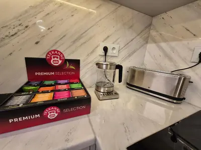 a counter with a blender and a box on it at The VERTEX in Sofia