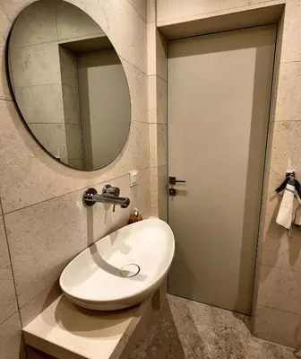 a bathroom with a sink and a mirror at The VERTEX in Sofia