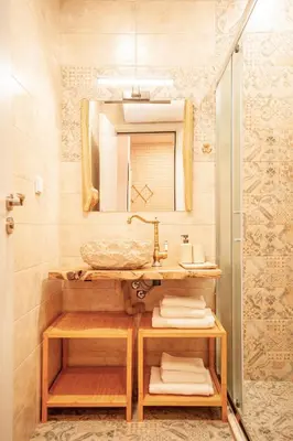 a bathroom with a sink and a mirror at Golden Lake 526 at Oak Residence in Smolyan