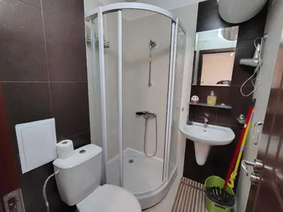 a bathroom with a shower and a toilet and a sink at Great view studio Pirin Palace in Bansko