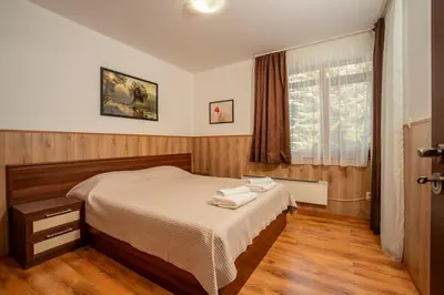 a bedroom with a bed and a window at ЕлеаНора, Смолянски езера EleaNora Smolyan lakes in Smolyan