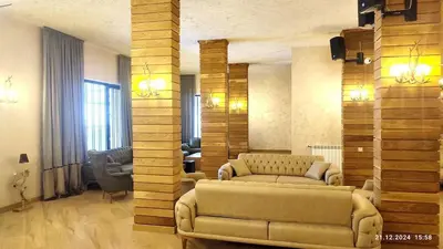 a living room with a couch and a table at Grand Studio B27 in Pamporovo