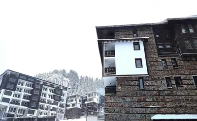 a building with a window on the side of it at Grand Studio B27 in Pamporovo