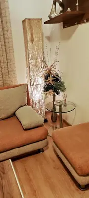 a living room with a couch and a table at Spacious, Comfortable Top Central Apartment in Sofia