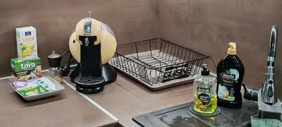 a kitchen counter with a mixer and a basket on it at Spacious, Comfortable Top Central Apartment in Sofia