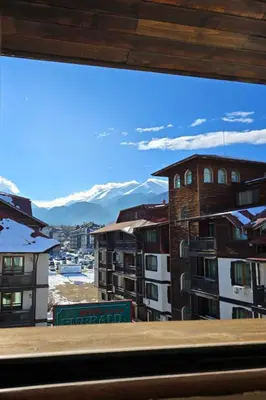 a view from a window of a city at Bansko Apartment Next To The Ski Lift in Bansko