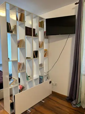 a room with a white book shelf at Montepinar Apartment Grand Resort Pamporovo in Pamporovo