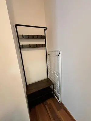 a stair case in a room with a wall at Montepinar Apartment Grand Resort Pamporovo in Pamporovo
