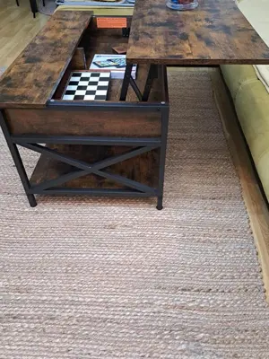 a wooden coffee table with a checkered table at Sunny Mountain View apartment in Razlog