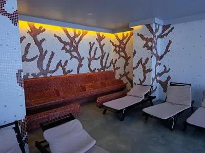 a waiting room with two chairs and a bench at Sunny Mountain View apartment in Razlog