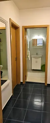 a bathroom with a tub and a sink in a room at Boutique Apartment blue 3 in Plovdiv