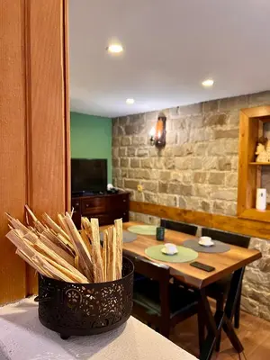 a dining room with a table and a table and sidx sidx sidx at Вила Рози, Семково in Semkovo