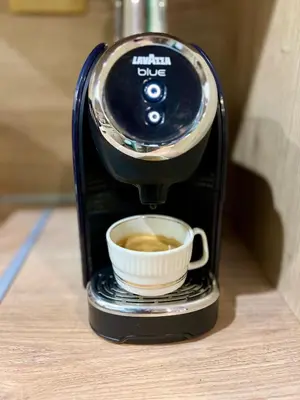 a coffee maker with a cup of coffee at Вила Рози, Семково in Semkovo