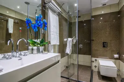 a bathroom with a sink and a shower at Best Western Plus Olives City Hotel - Free Pool & Parking in Sofia