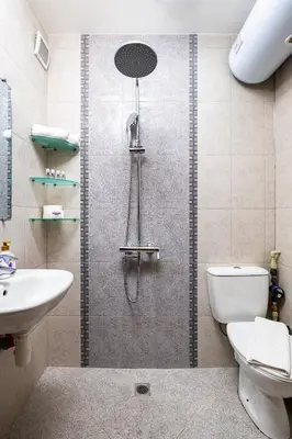 a bathroom with a shower with a toilet and a sink at The Crash Pad Studio by Flat Mаnager in Plovdiv