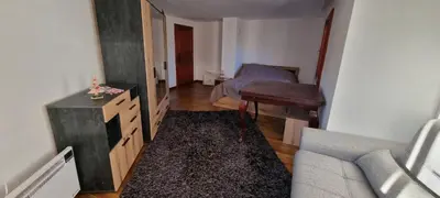 a small living room with a couch and a table at BoroVille in Raduil