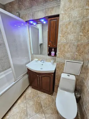 a bathroom with a toilet and a sink and a shower at Two charming Studios in Trinity Bansko with balcony and free parking by Flat Mаnager in Bansko